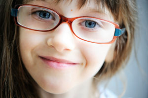 child with glasses