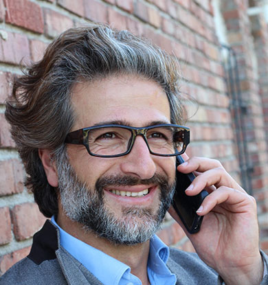 Man on phone with glasses