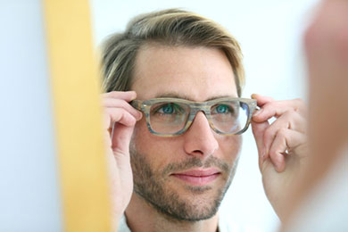 Man trying on glasses