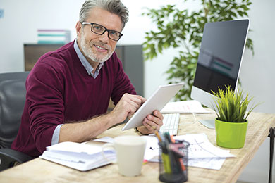 Man with glasses at desk