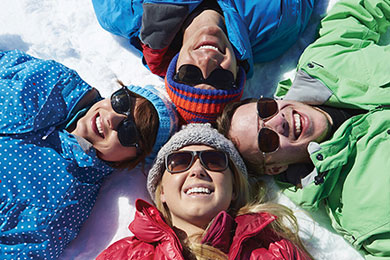 Laying in snow with glasses