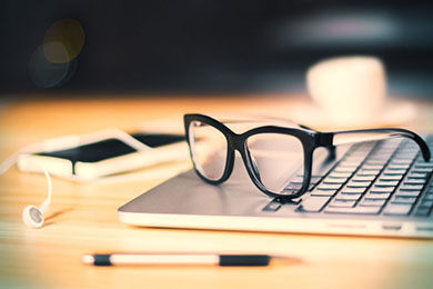 Glasses on laptop