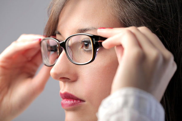 Woman trying on glasses